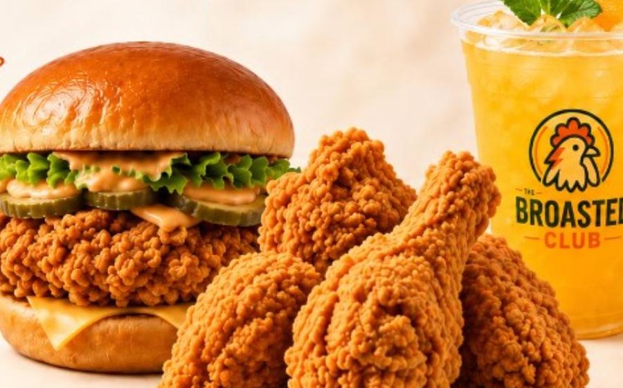 Broasted chicken burger, fried chicken pieces and a fresh orange juice from The Broasted Club
